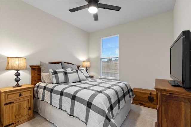 bedroom with light carpet and ceiling fan