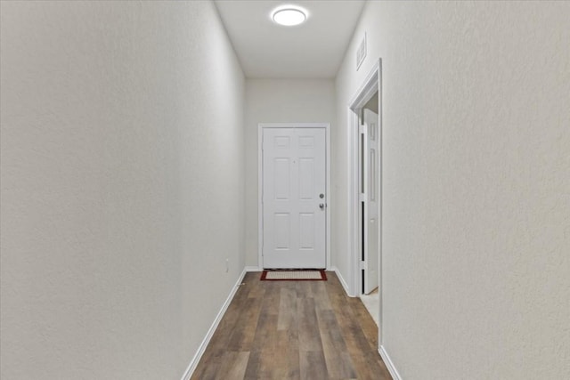 808 Beacon Hts, Seguin, TX 78155 - corridor with dark wood finished floors, baseboards, and a textured wall