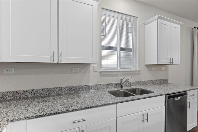 808 Beacon Hts, Seguin, TX 78155 - kitchen with stainless steel dishwasher, a sink, white cabinets, and healthy amount of natural light