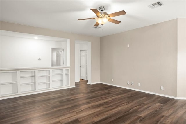 spare room with ceiling fan and dark hardwood / wood-style flooring