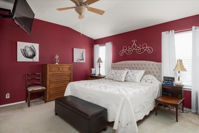 carpeted bedroom featuring ceiling fan and lofted ceiling