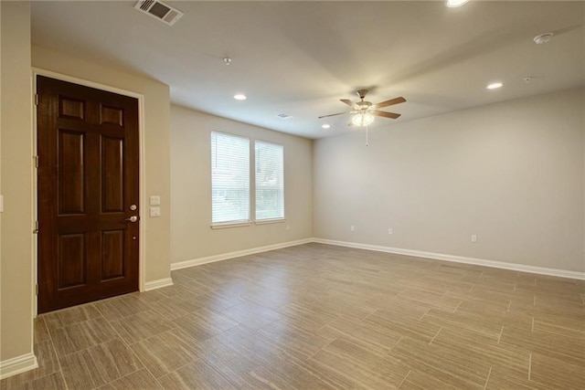 entrance foyer with ceiling fan