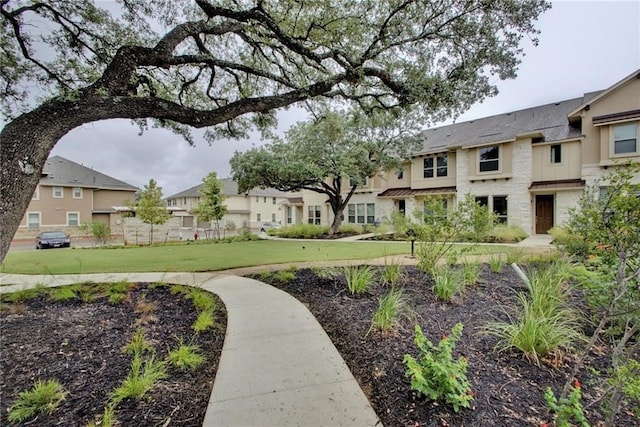 surrounding community featuring a lawn