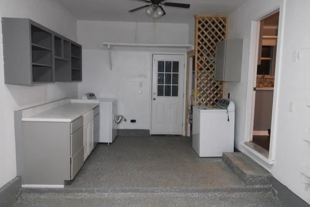 kitchen featuring washing machine and clothes dryer, gray cabinets, and ceiling fan