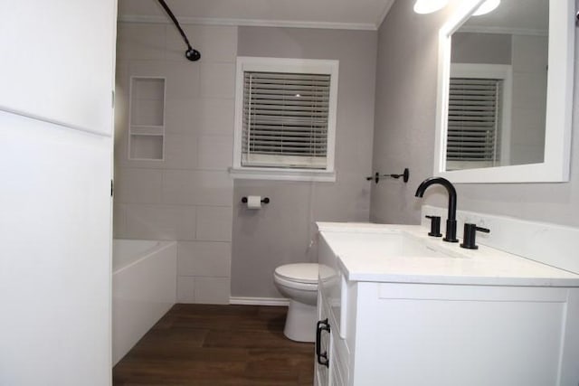 full bathroom with toilet, vanity, ornamental molding, and hardwood / wood-style flooring