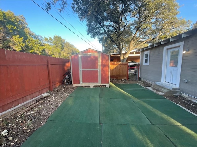 view of patio with a storage shed