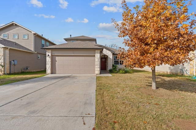 view of front facade featuring a front yard and a garage