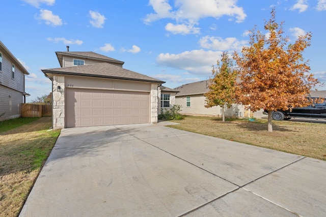 view of front of property with a front yard and a garage