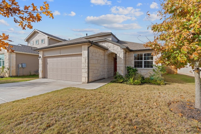 view of front of home featuring a garage and a front lawn