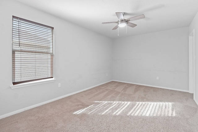 unfurnished room featuring carpet floors and ceiling fan