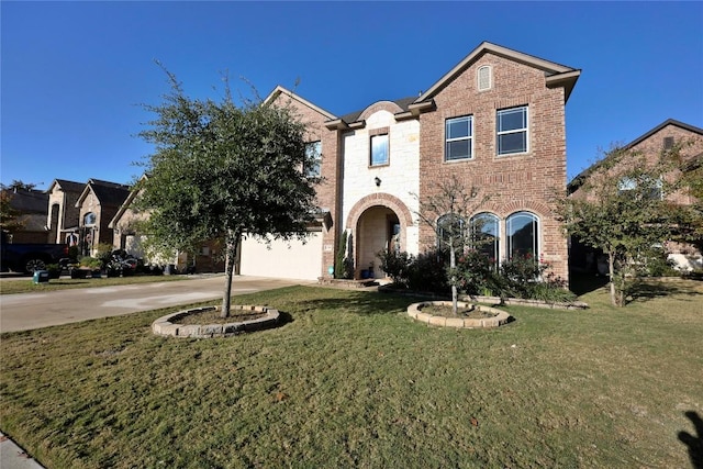 view of front of house with a front yard and a garage