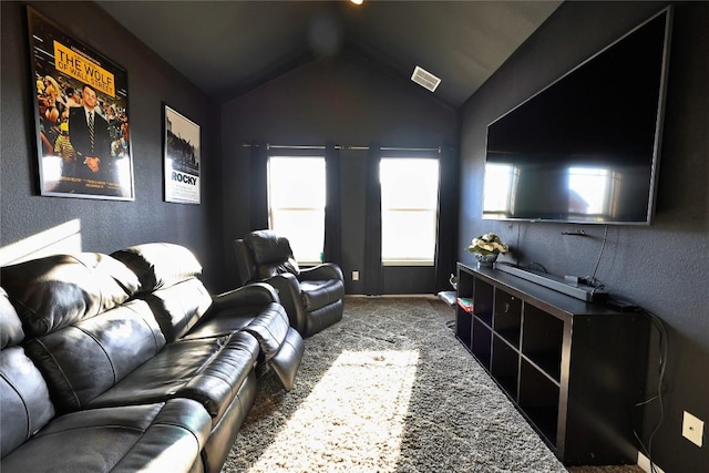 carpeted living room with plenty of natural light and vaulted ceiling