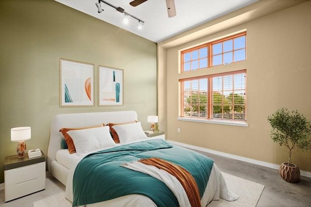 bedroom featuring track lighting and ceiling fan