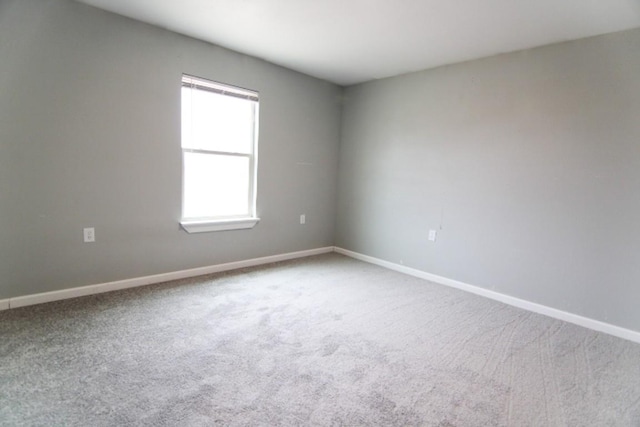 unfurnished room featuring carpet floors