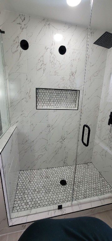 bathroom featuring an enclosed shower