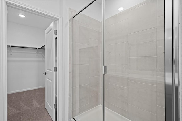 bathroom with a shower with shower door