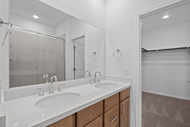 bathroom featuring vanity and an enclosed shower