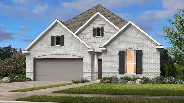 view of front facade featuring a garage and a front lawn