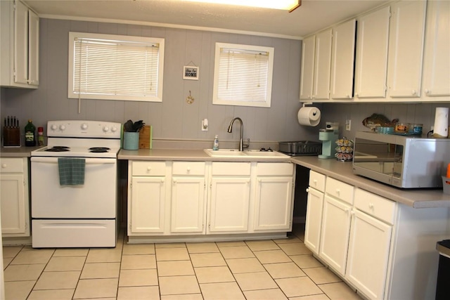 kitchen with white cabinetry, sink, crown molding, white appliances, and light tile patterned floors