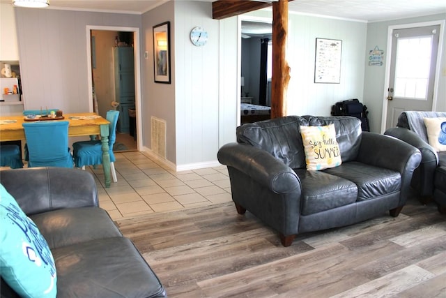 living room featuring hardwood / wood-style floors and ornamental molding