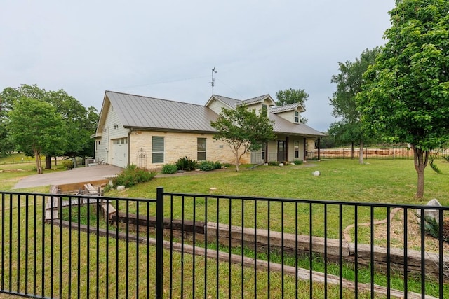 view of front facade featuring a front lawn and a garage