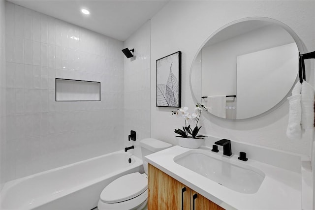 full bathroom featuring vanity, toilet, and tiled shower / bath