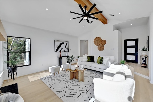 living room featuring vaulted ceiling with beams, light hardwood / wood-style floors, and ceiling fan