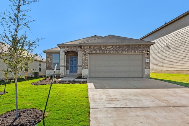 347 Paradise Canyon Dr, Jarrell, TX 76537 - view of front of house with a garage, central air condition unit, and a front lawn
