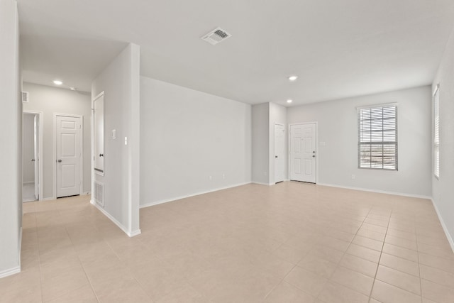 spare room featuring light tile patterned floors