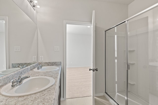 bathroom featuring vanity, tile patterned floors, and walk in shower