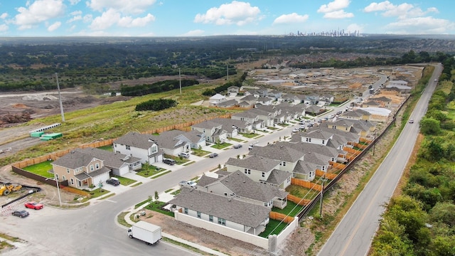 birds eye view of property with a residential view