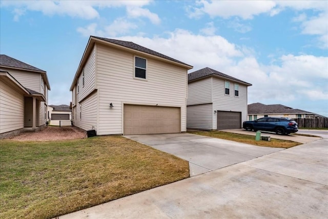 view of front of house featuring a front yard and a garage