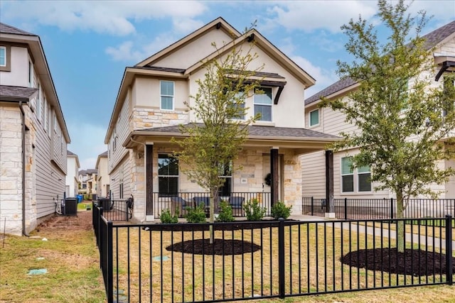 view of front of house with covered porch, a front lawn, and central AC unit