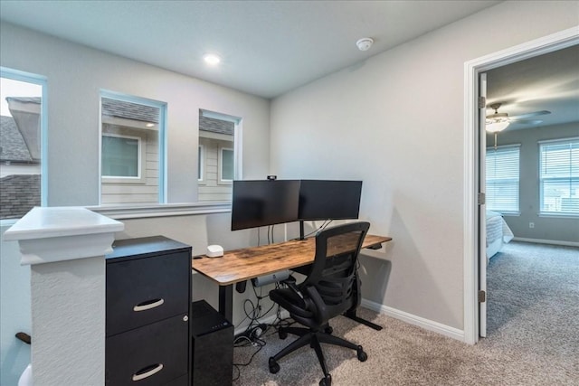 carpeted office featuring ceiling fan