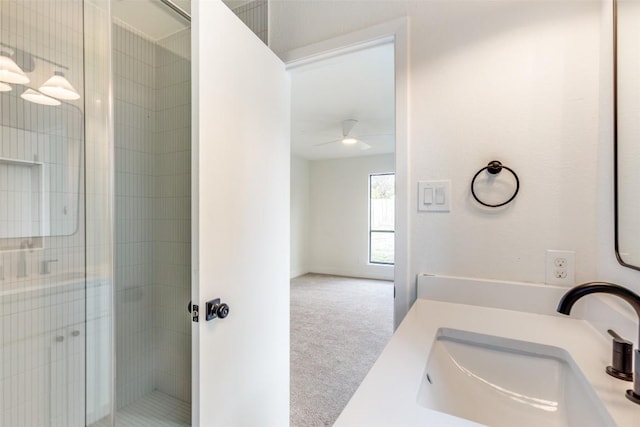 bathroom featuring ceiling fan, walk in shower, and vanity