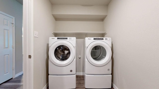 washroom featuring washer and dryer and dark hardwood / wood-style floors