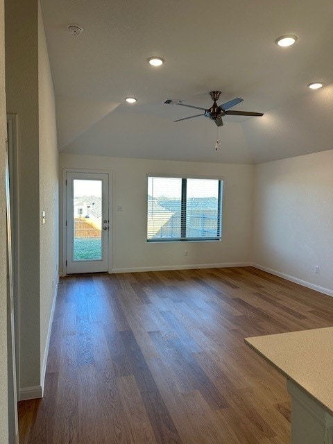 223 Spirit St, Elgin, TX 78621 - unfurnished room with ceiling fan, wood finished floors, recessed lighting, a smoke detector, and vaulted ceiling