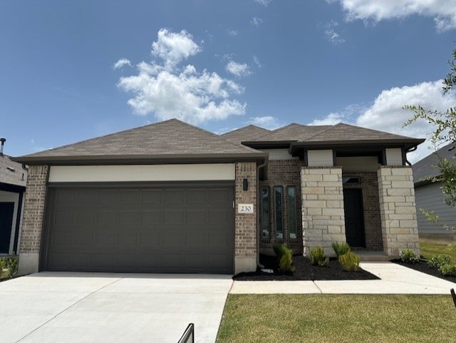230 Hidalgo Ln, Elgin, TX 78621 - view of front of home featuring brick siding, an attached garage, concrete driveway, and a shingled roof