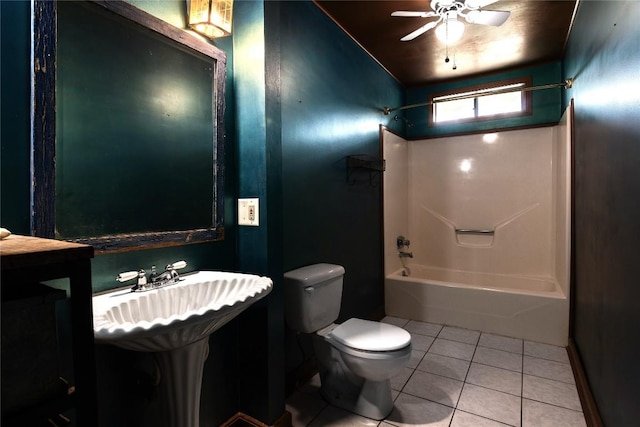 bathroom with ceiling fan, tile patterned flooring,  shower combination, and toilet