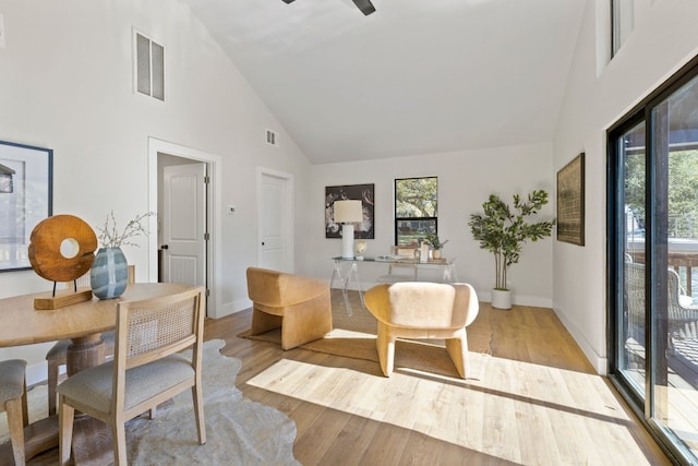 306 Bluebird Cir, Marble Falls, TX 78654 - dining area featuring high vaulted ceiling, plenty of natural light, and light wood finished floors