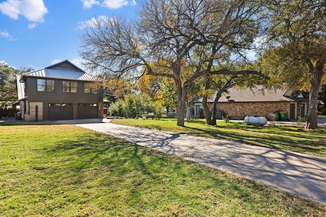 view of front of house with a front lawn and a garage