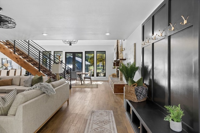 living room featuring a chandelier and dark wood-type flooring