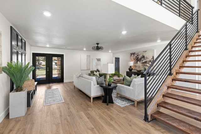 306 Bluebird Cir, Marble Falls, TX 78654 - living room featuring stairway, french doors, recessed lighting, and light wood-style flooring