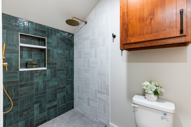 bathroom featuring a tile shower, tile patterned flooring, a textured ceiling, vaulted ceiling, and toilet