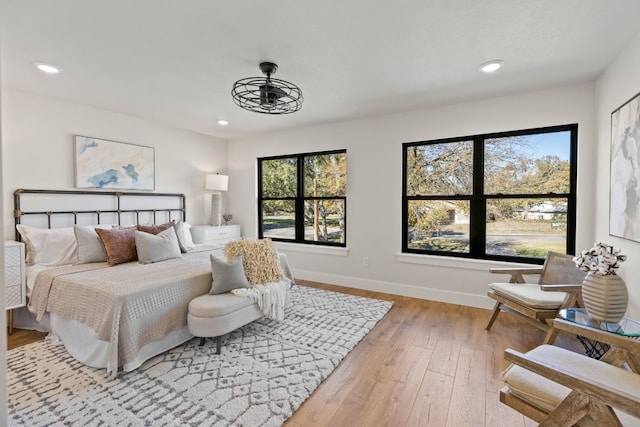 306 Bluebird Cir, Marble Falls, TX 78654 - bedroom featuring light wood-style flooring and recessed lighting