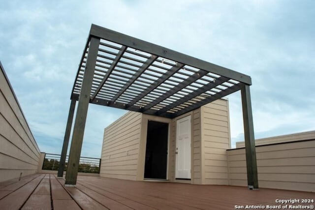 view of outbuilding with a pergola