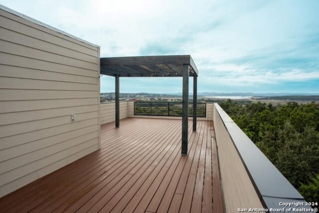 wooden deck with a water view