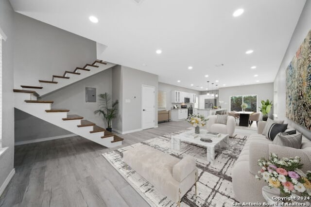 unfurnished living room with light wood-type flooring