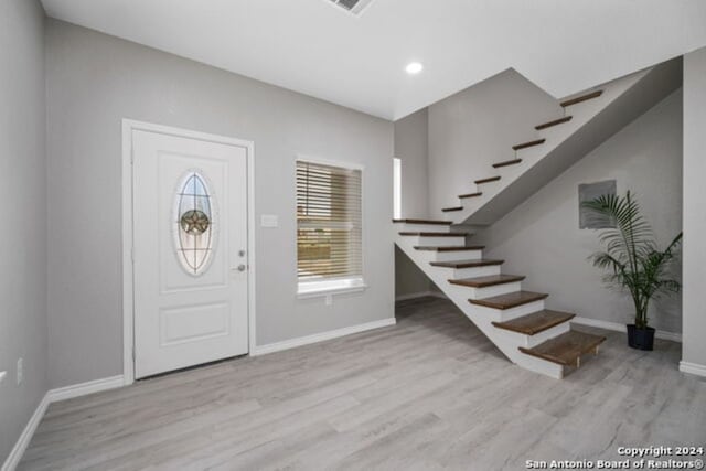 entryway with light hardwood / wood-style flooring