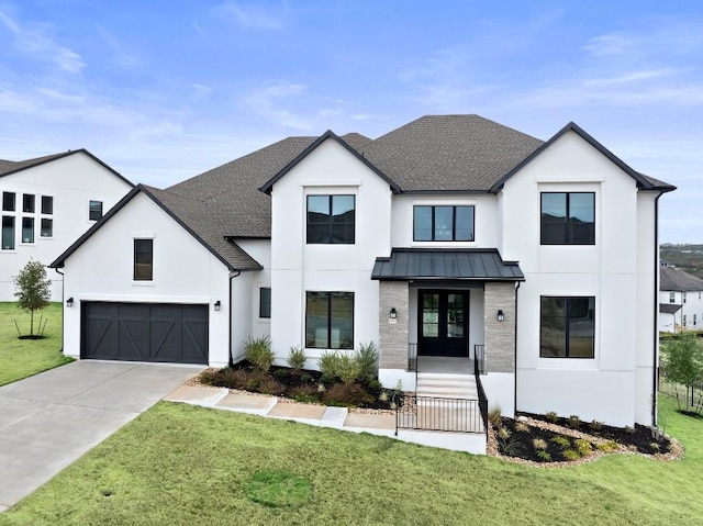 modern inspired farmhouse featuring a garage and a front yard